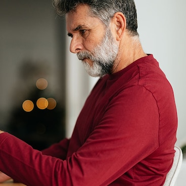 Man looking over charts